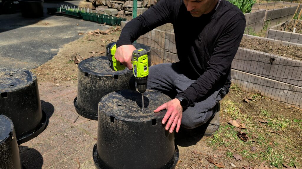 Drilling holes into bottom of containers with a spade drill bit